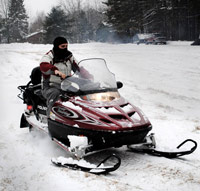 Teen on a snowmobile