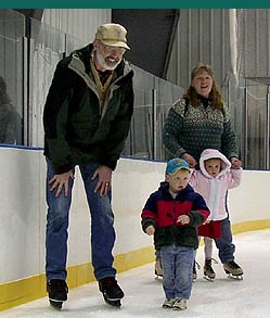 family ice skating at forum
