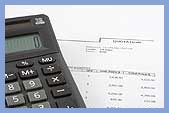 calculator and mortgage papers