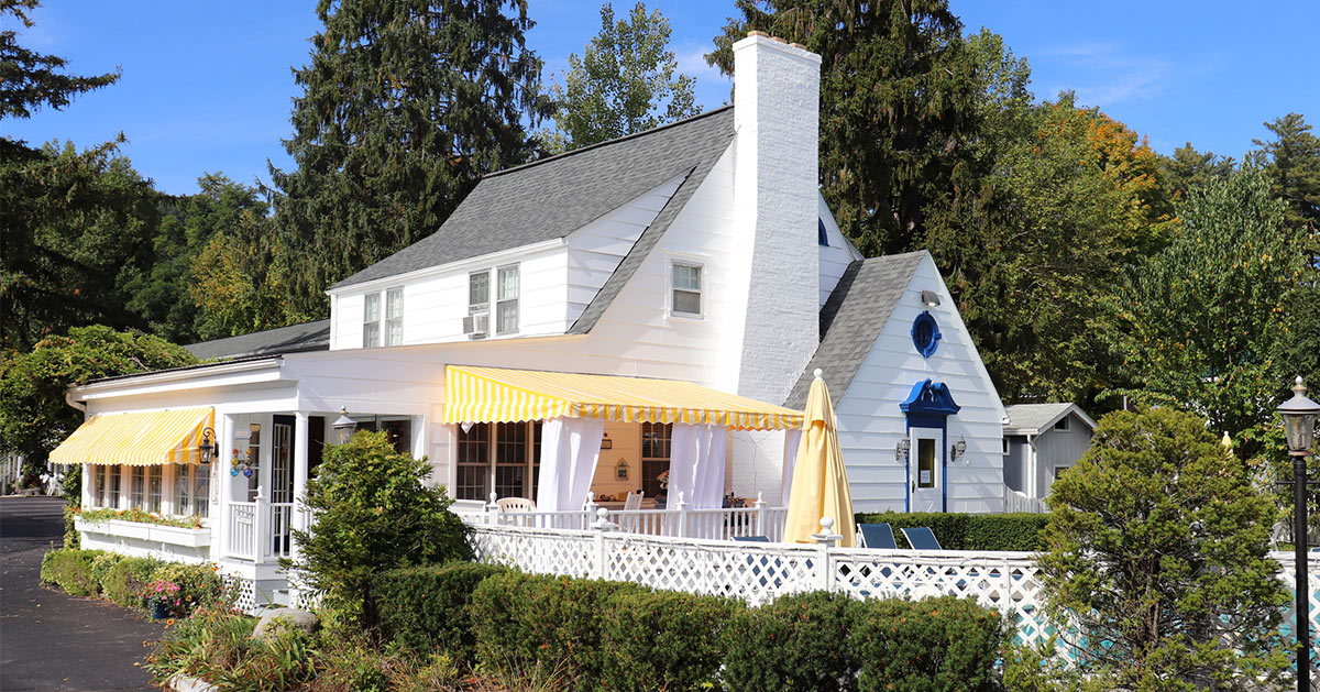 office at the admiral motel, a white house with yellow awnings