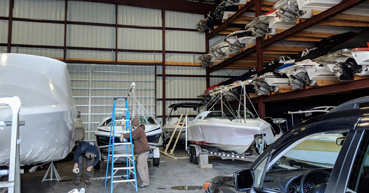 men working on boat storage