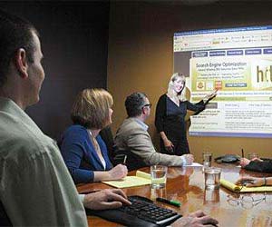 Woman giving a presentation in an office 