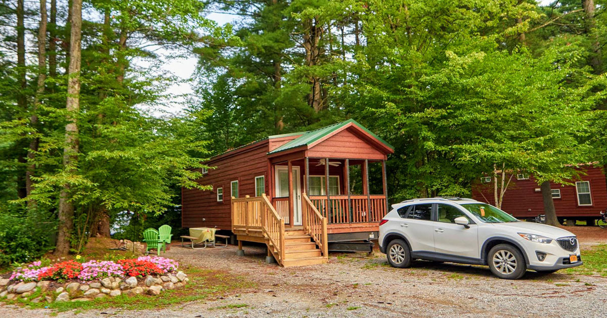 site with a cabin and car