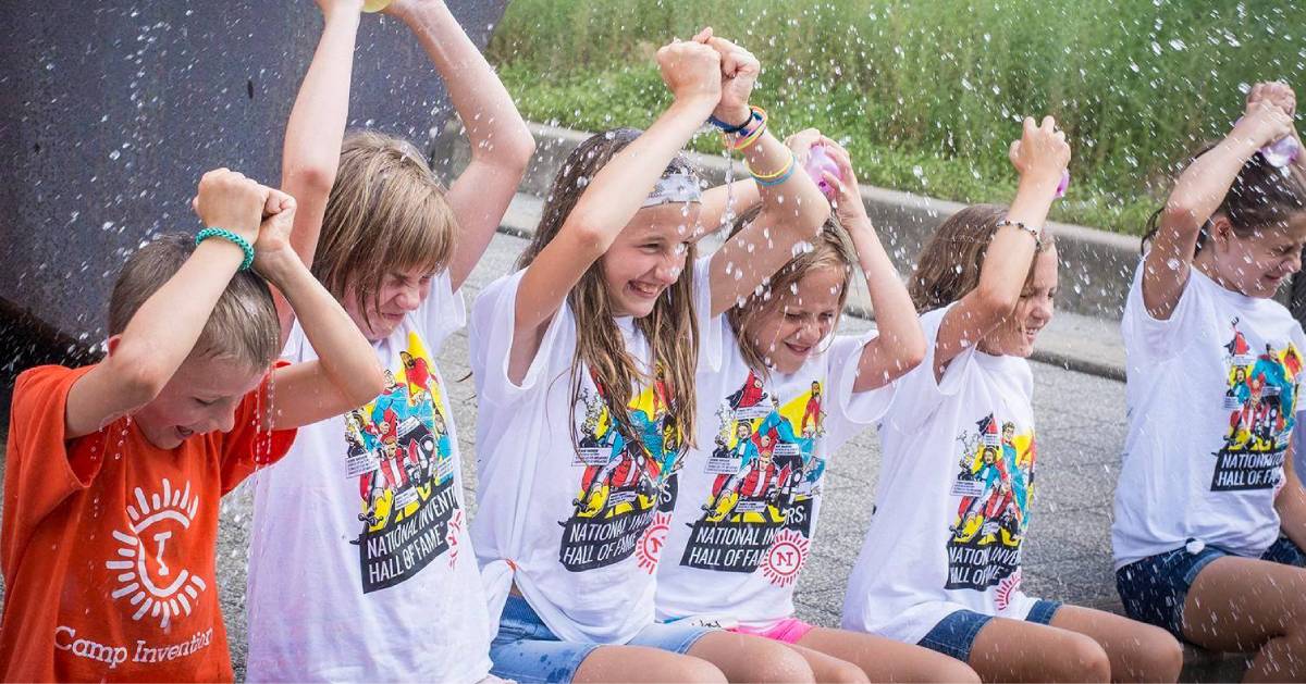 camp kids getting splashed with water