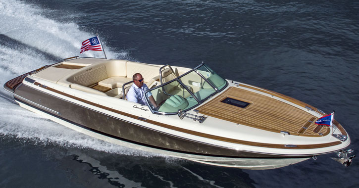 a boat in the water with a man operating it