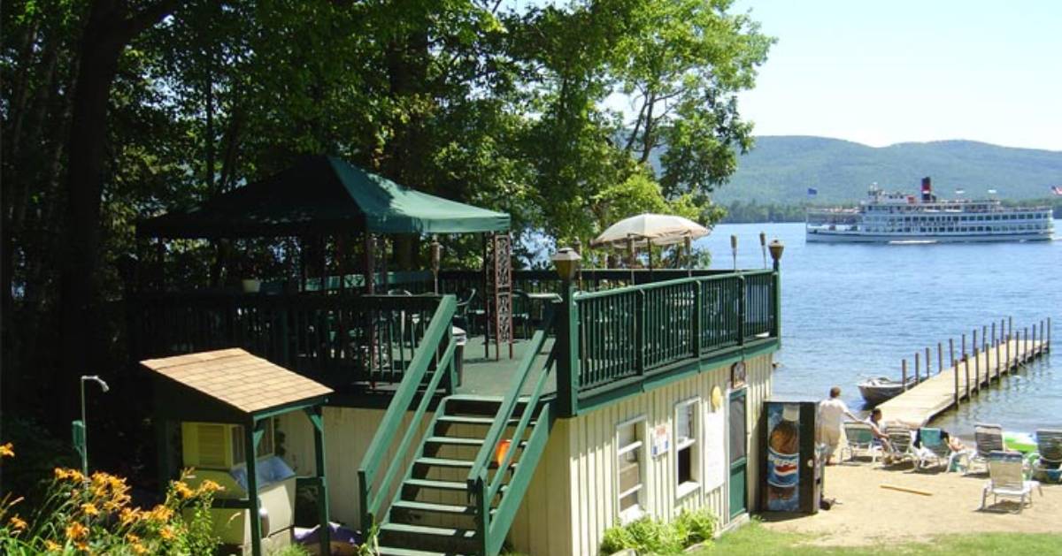 patio area and boat dock in lake