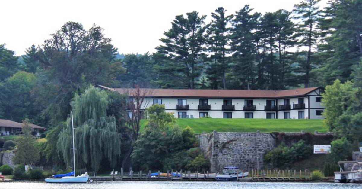 view of lodging property on a small cliff overlooking a lake