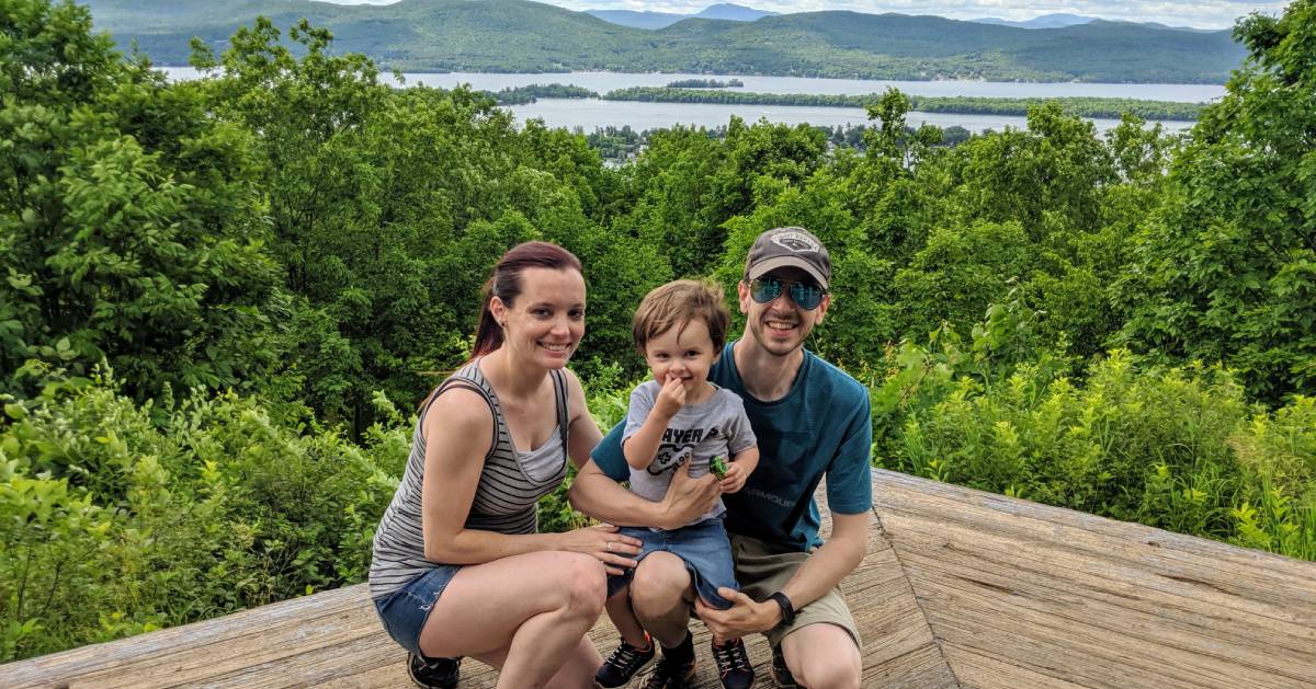family of three with toddler at summit