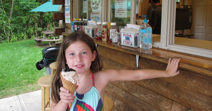 young girl holding a waffle ice cream cone