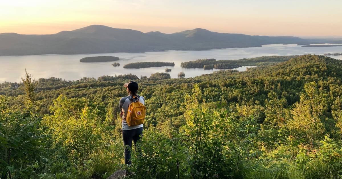 woman looks out at summit