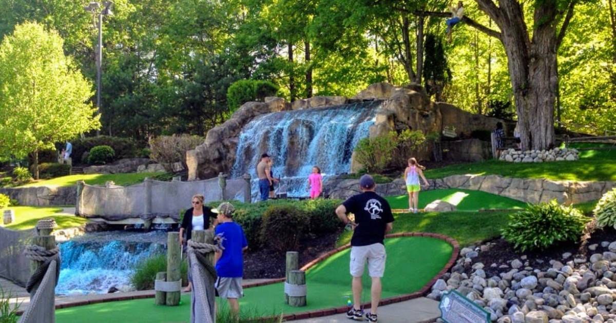 people on a mini golf course