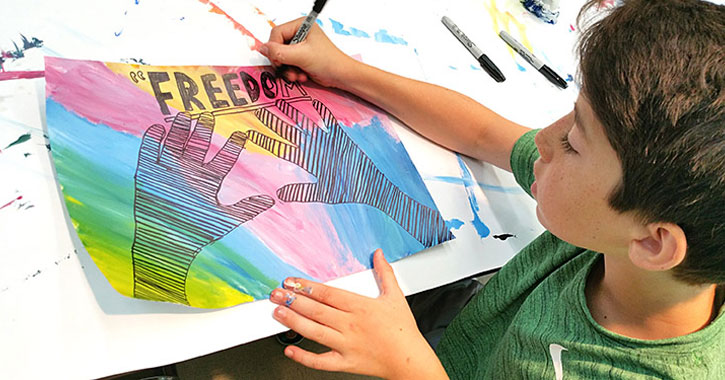 a kid doing a painting