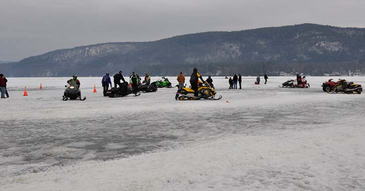 snowmobiles on a frozen lake