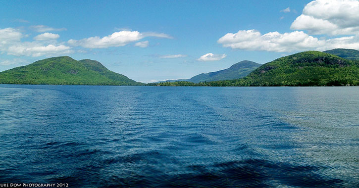 photo of mountains and lake