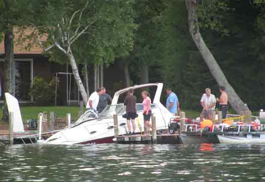 Sunken Boat Being Lifted From Water