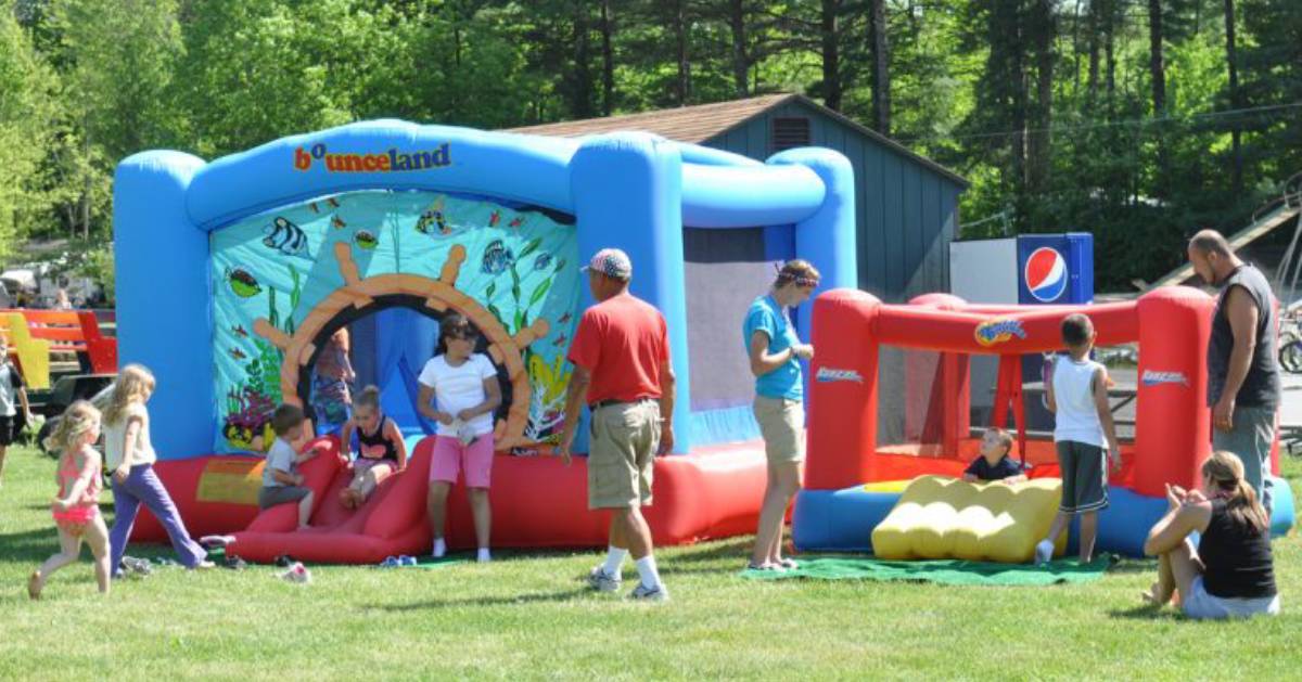 people outside near a bounce house