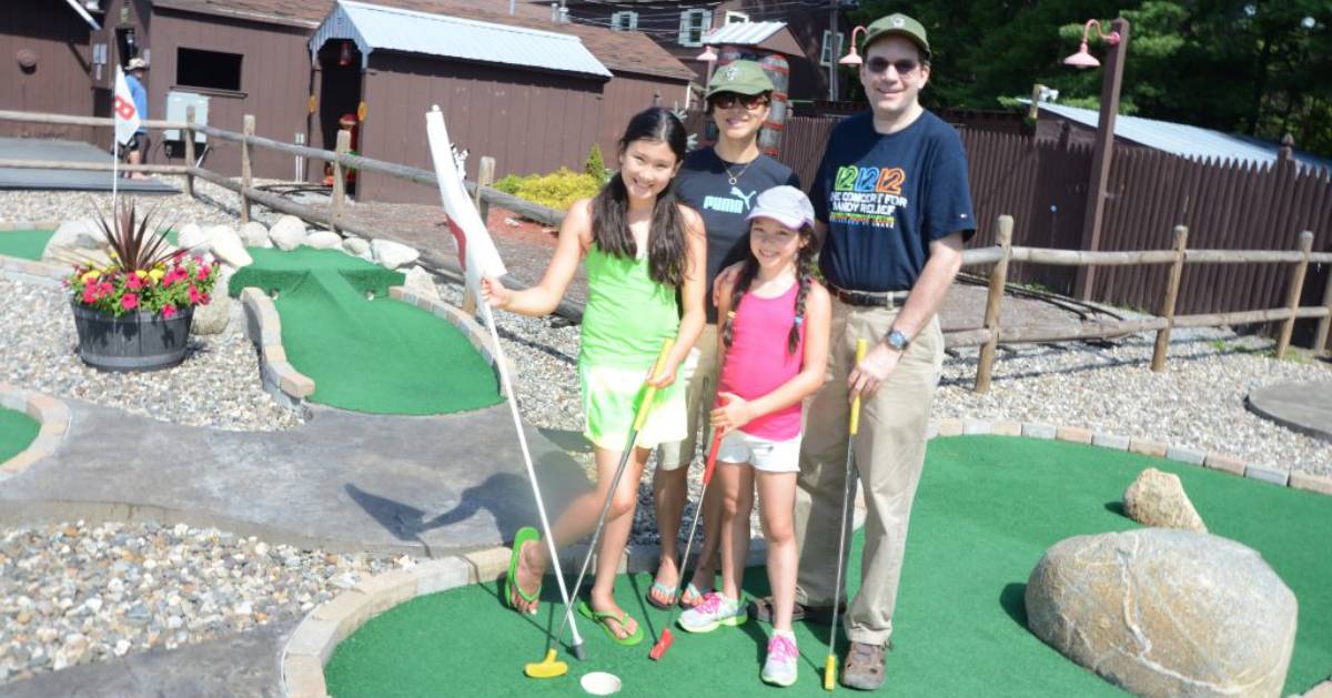 people on a mini golf course