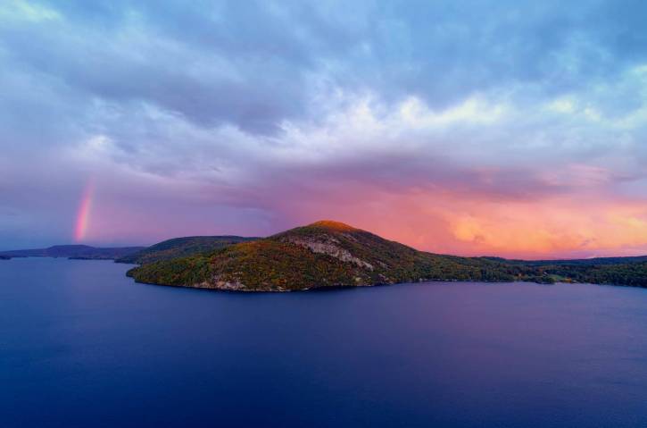 Pink and blue sunset over mountain and lake