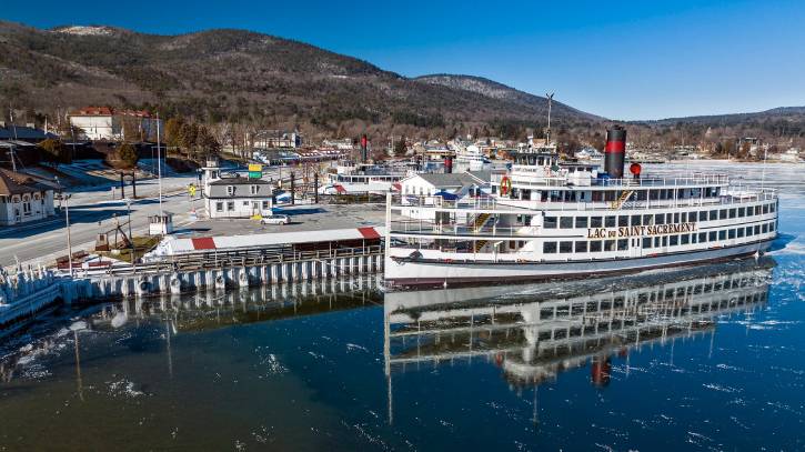 boat on water with barely formed ice