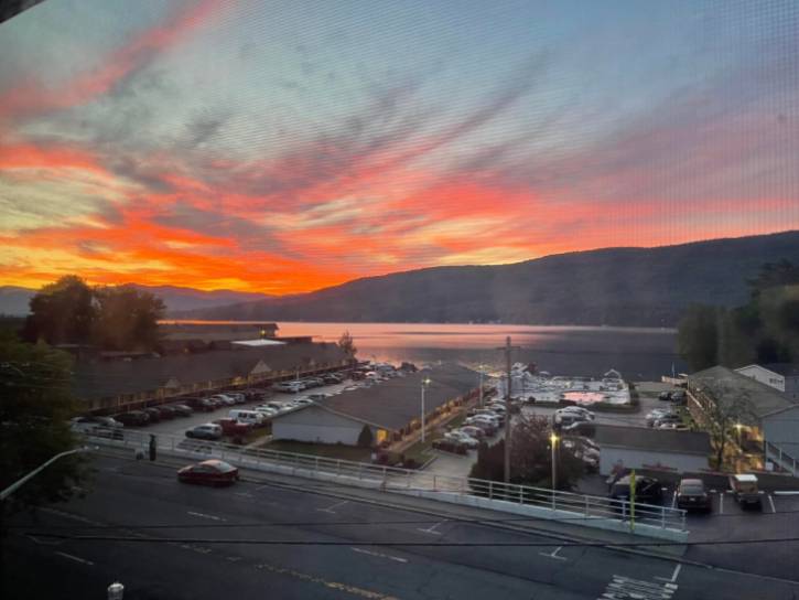 sunrise over lake and parking lot