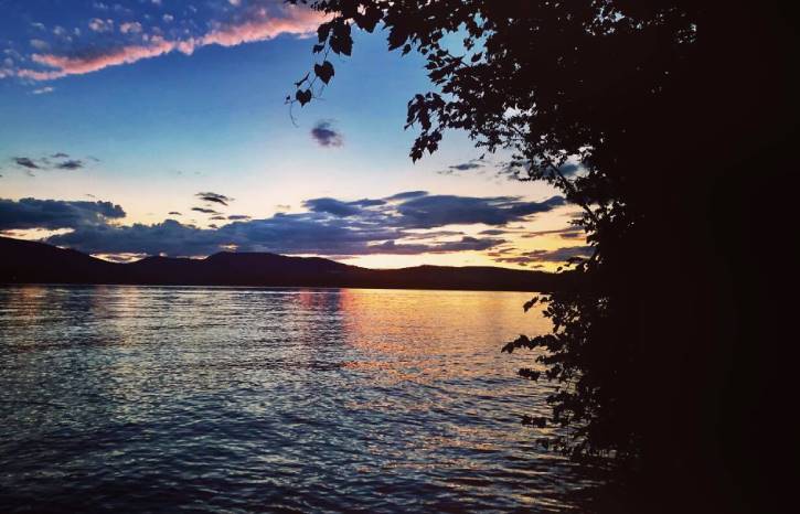 Sunset over a lake with mountains