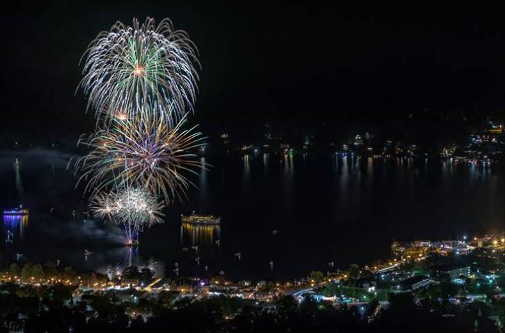 fireworks at night over lake