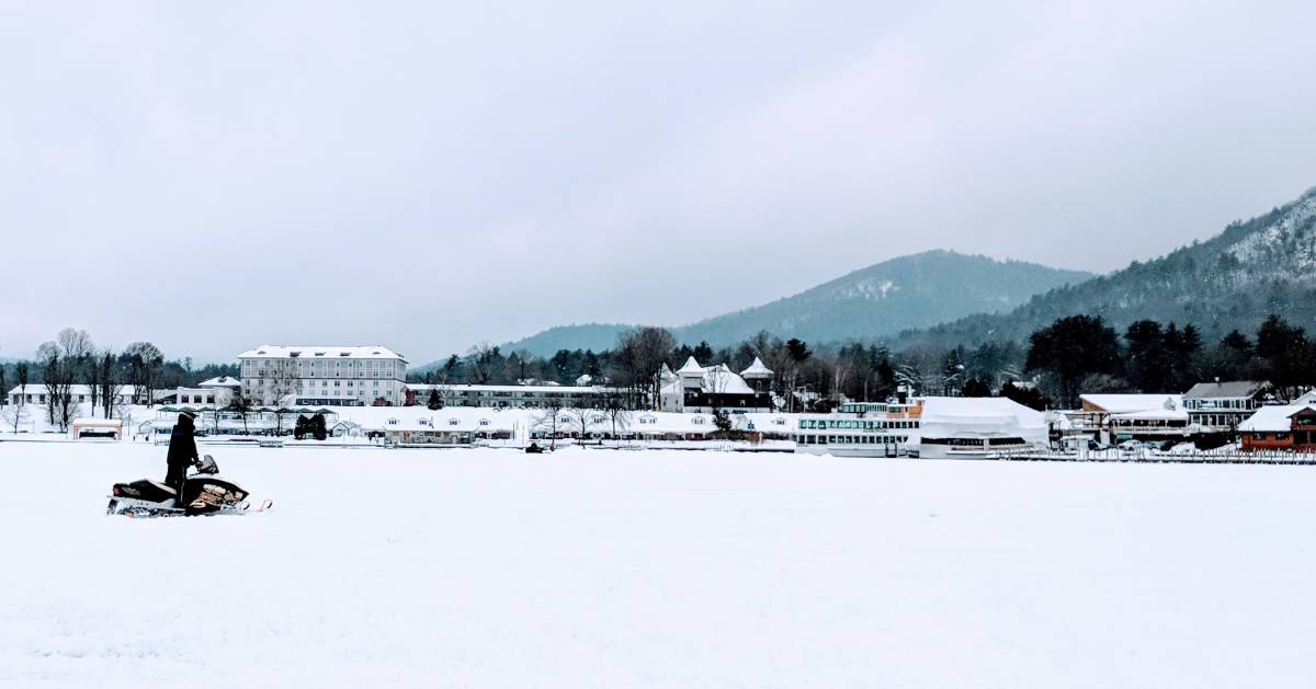 snowmobiler on Lake George in winter