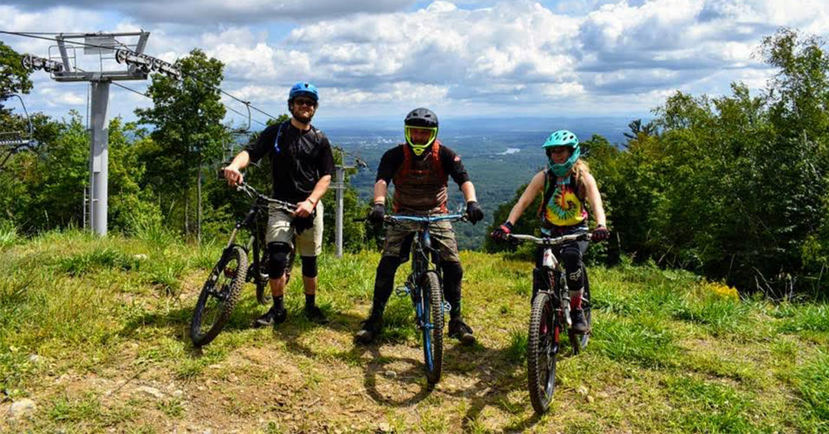 three mountain bikers