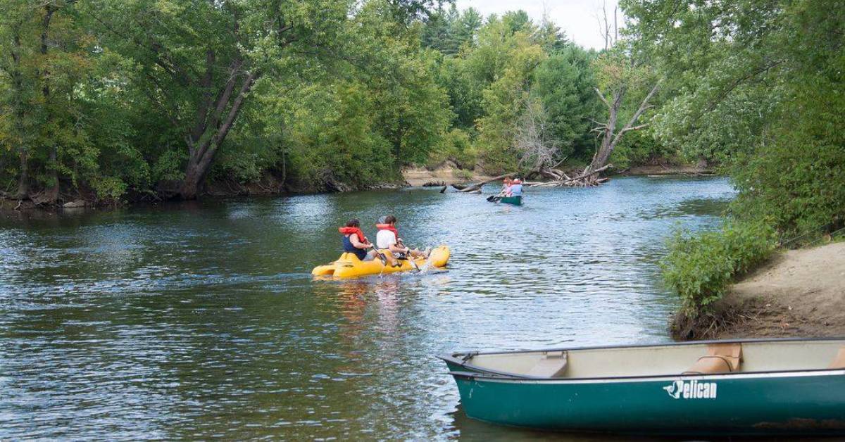 people paddling on a river