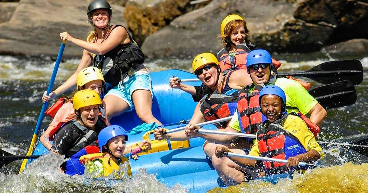 group of people whitewater rafting