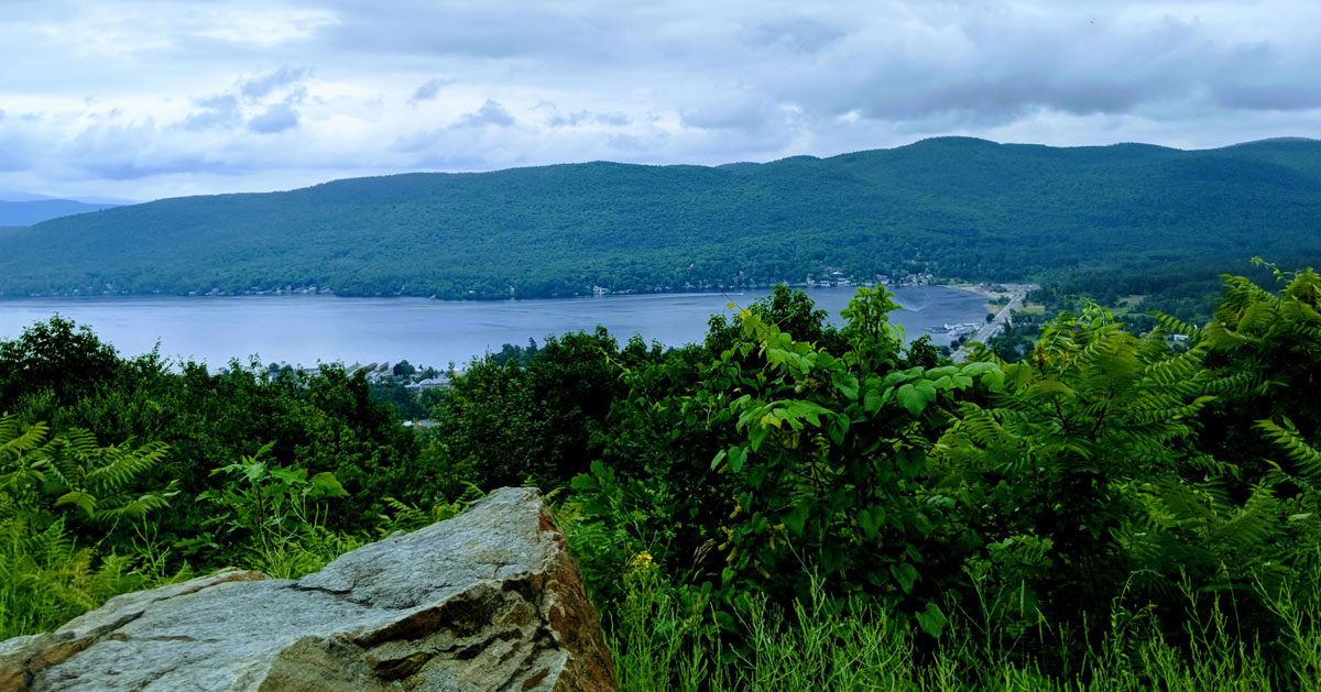 view from summit with lake and mountains