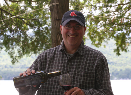 man pouring wine