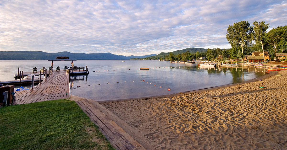 a sandy beach on lake george
