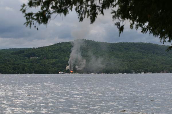 smoke and fire on the opposite shore of lake george