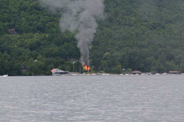 smoke and fire on the opposite shore of lake george