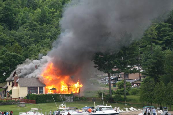 house on fire with gray smoke