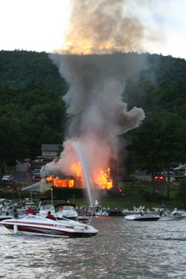 firefighters putting out fire with lots of smoke in the air