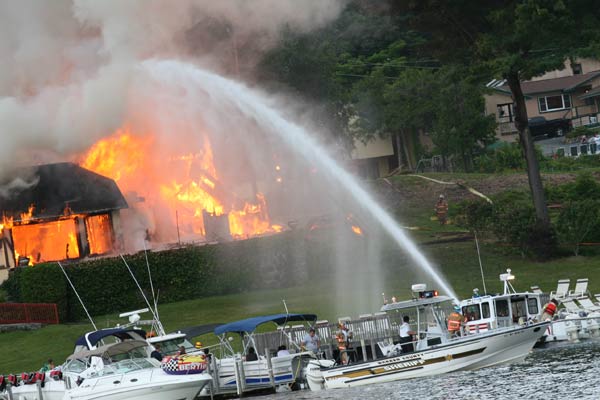 crew putting out fire from the lake