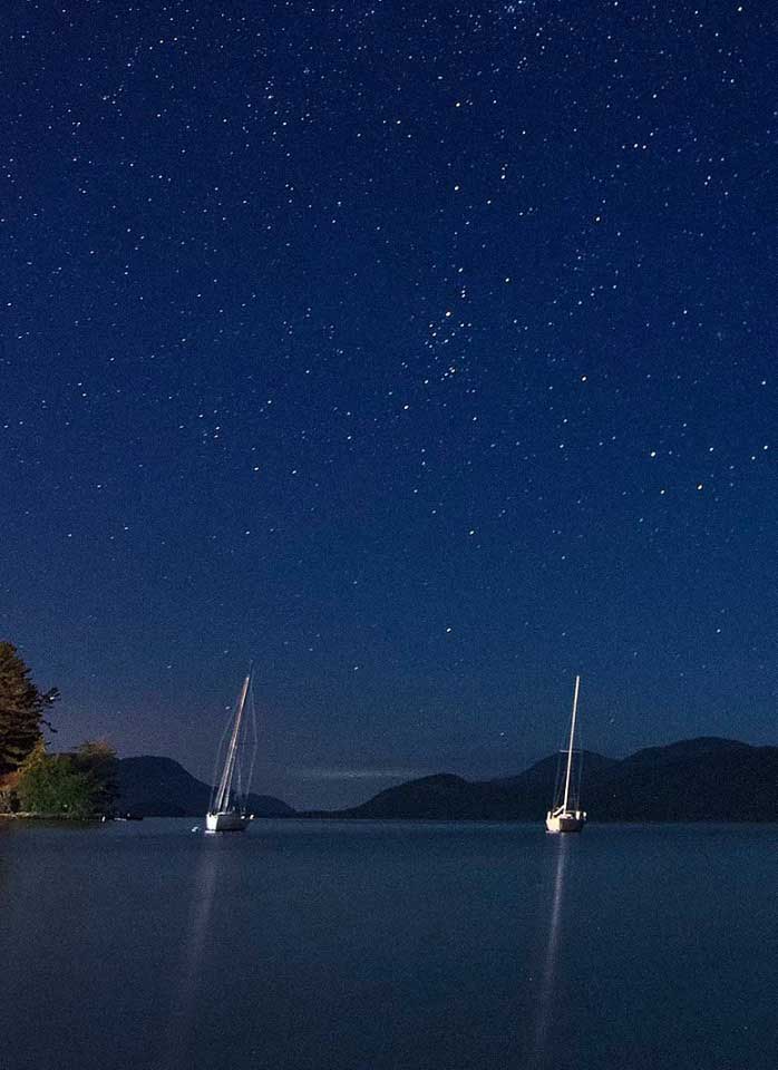 sailboats moored on lake george