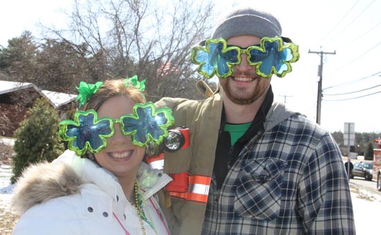 couple wearing four-leaf clover glasses